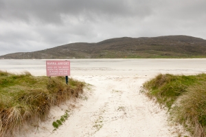 Barra airport beach with warning sign visible